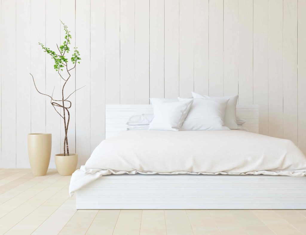 White,Minimalist,Bedroom,Interior,With,Double,Bed,On,A,Wooden